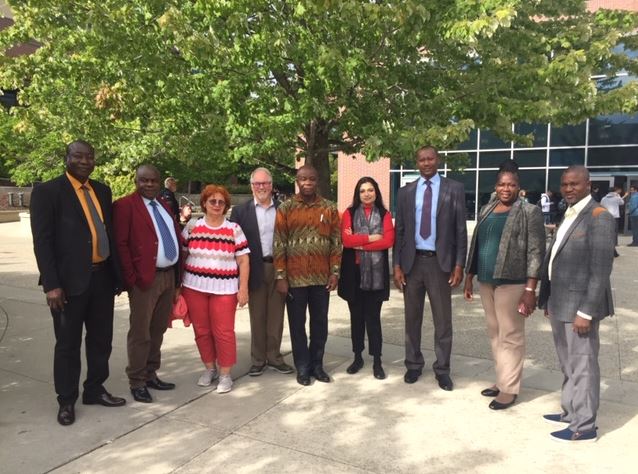 Delegation from the University of Development Studies in Ghana pictured with UBCO leadership in front of UBCO LIbrary